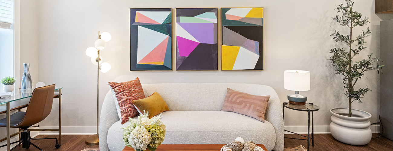 Contemporary Living Space in Senior Units Stylish living area in unit with modern sofa, art decor, and indoor plants.